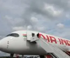 Passagierflugzeug in Indien in Gebäude gestürzt - Viele Tote befürchtet