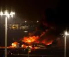 Tote und brennender Airbus nach Flugzeug-Kollision in Japan