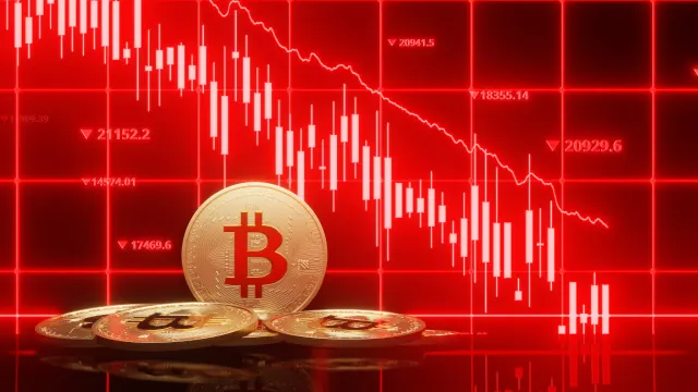 Ein fallender Bitcoin-Kurs ist zu sehen.